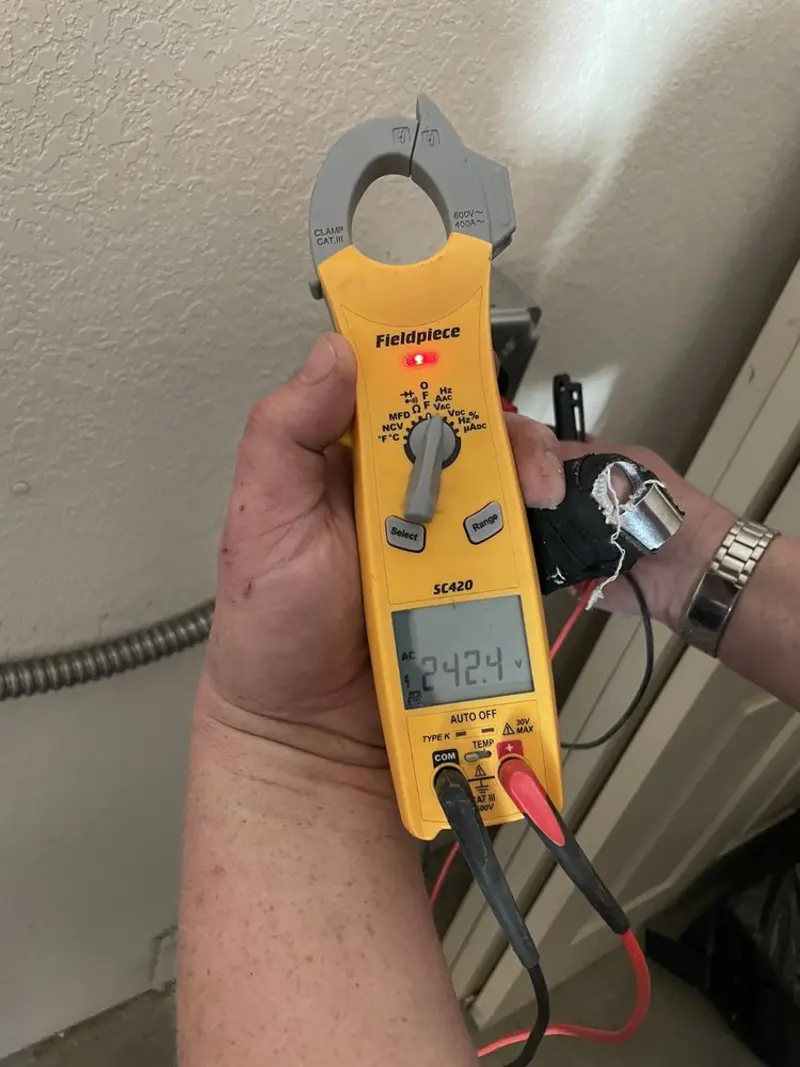 Voltage testing with clamp meter during Circuit Breaker Repair in Riverwoods